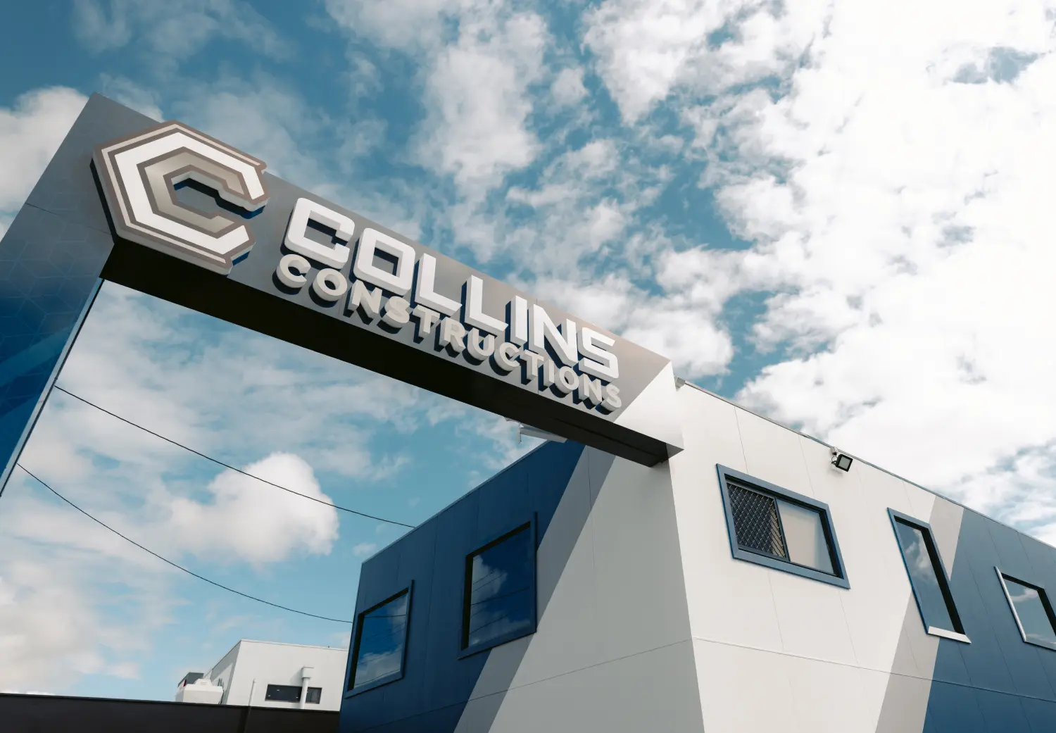 A building with a sign that says collin construction