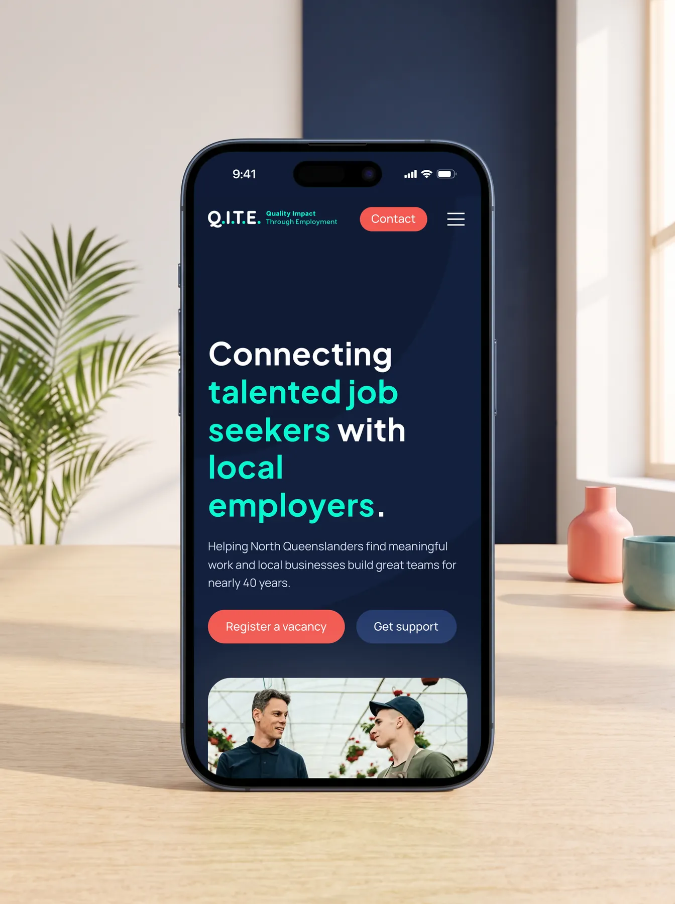 Q.I.T.E. mobile website homepage on an iPhone 17 Pro