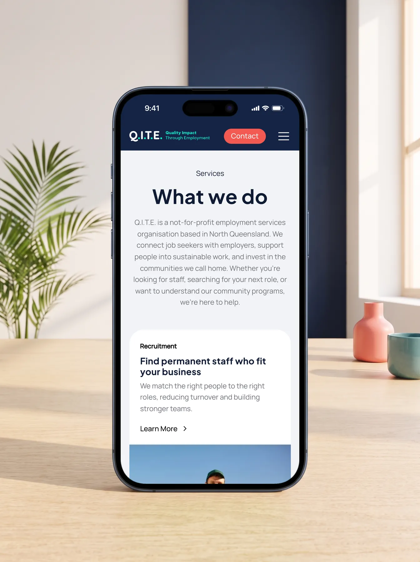 Q.I.T.E. mobile website What we do section on an iPhone 17 Pro