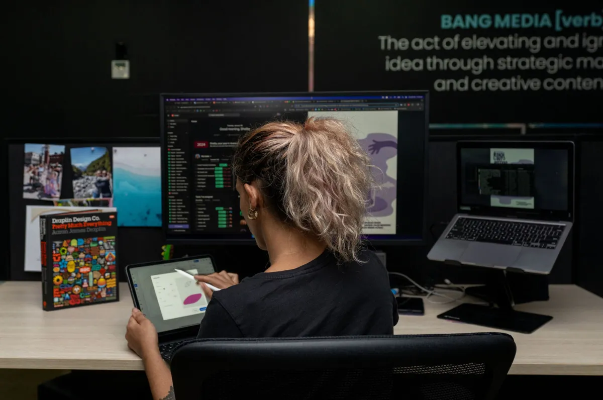 A Bang Media designer at work in the studio